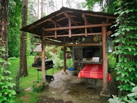 Homemade wooden gazebo with barbecue
