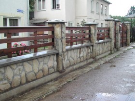 Combination fence of wood and stone