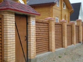 Wooden fence with horizontal boards
