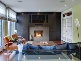 The interior of a small living room with fireplace