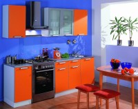 Kitchen with blue walls and red furniture