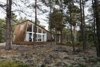 Design of wooden cottage in the woods