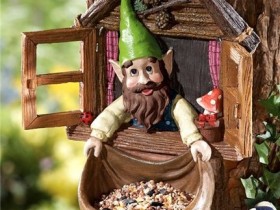 Feeder for birds in the form of an elf
