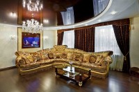 Living room with Golden sofa and dark stretch ceiling