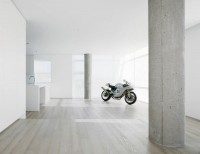The bike is in the interior of the apartment