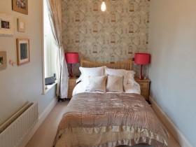 The design is very small bedroom in light tones