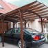 Carport polycarbonate, corrugated Board and wood with their hands.