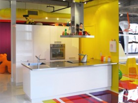 The kitchen is bright and loft-style