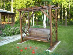 Decorative garden swing with pergola