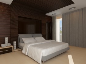 Dark bedroom with white bed