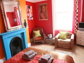Living room with fireplace in the style of kitsch