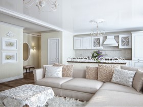 Белая кухня, совмещенная с гостиной комнатой